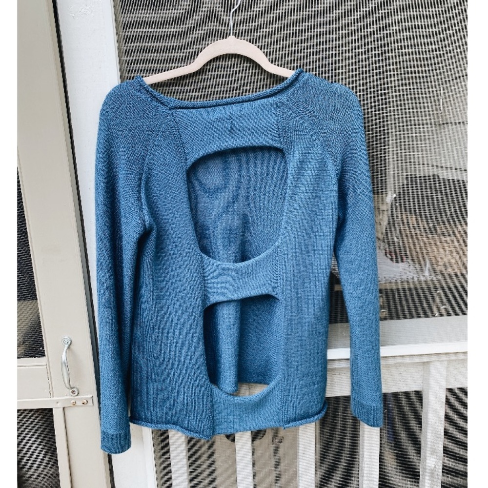Blue sweater with open back cutouts